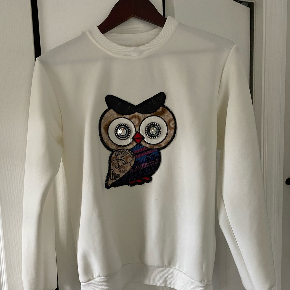 White Owl sweater.
